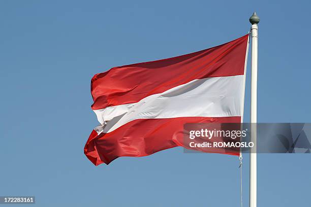 austrian flag against blue sky, austria - austria stock pictures, royalty-free photos & images