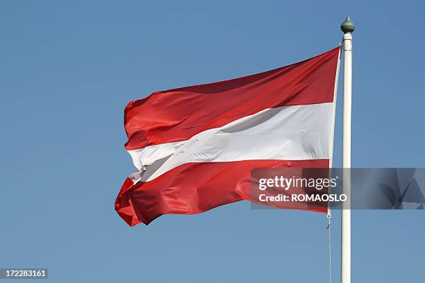 austrian flag against blue sky, austria - austrian flag stock pictures, royalty-free photos & images