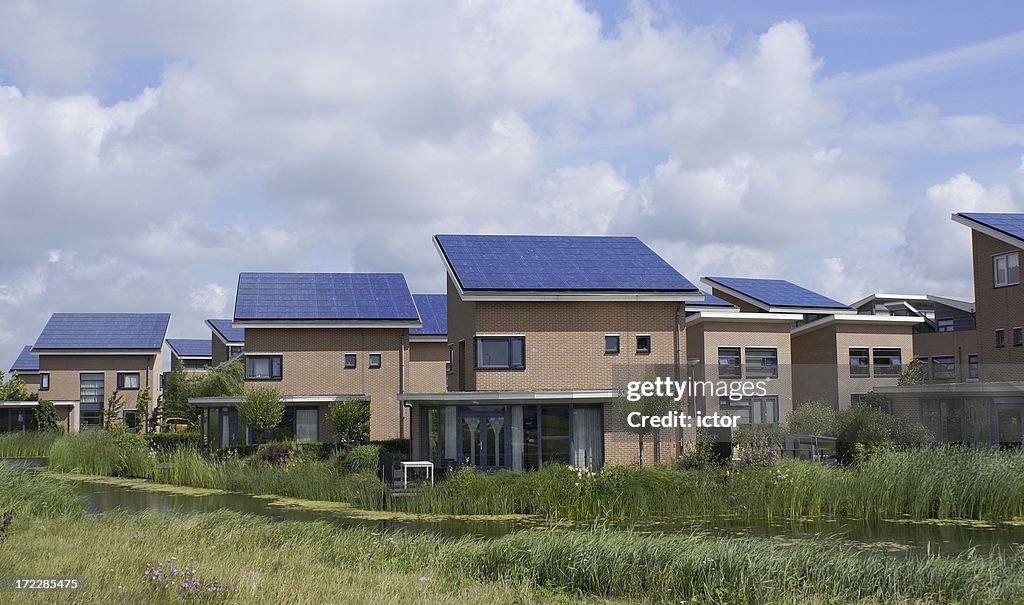 Houses with solar panels on roof