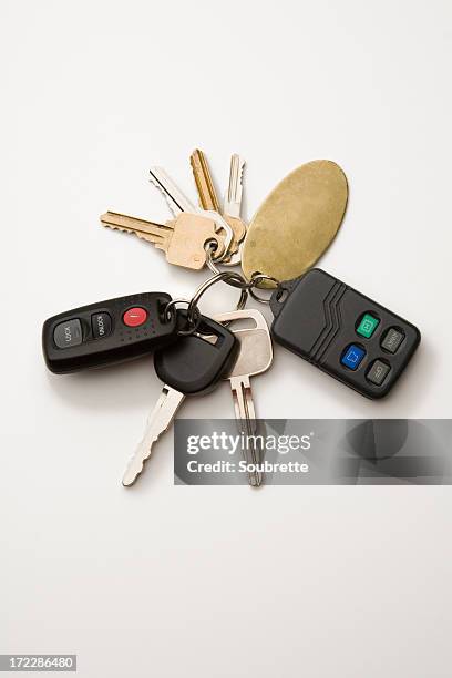 key ring with car keys and immobilizer on white background - car keys on white stock pictures, royalty-free photos & images