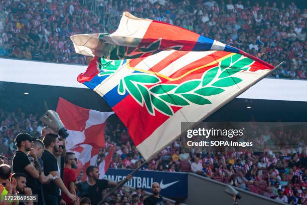 Supporter waves the Atletico Madrid flag during the football match of Spanish championship La Liga EA Sports between Atletico Madrid and Real...