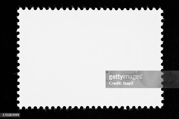 close-up of a blank white stamp, isolated on black - geperforeerd stockfoto's en -beelden