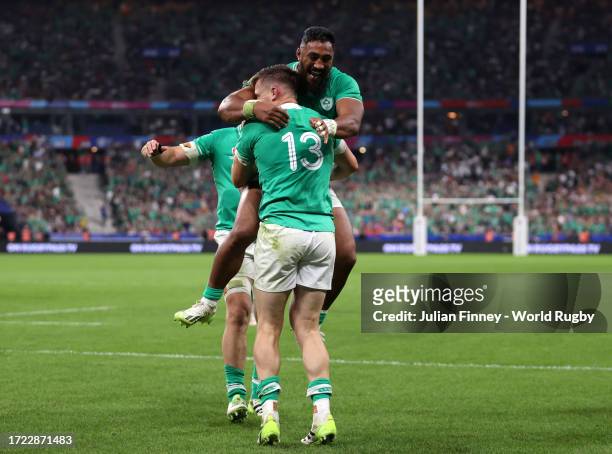 Garry Ringrose of Ireland celebrates scoring his team's sixth try with teammate Bundee Aki during the Rugby World Cup France 2023 match between...