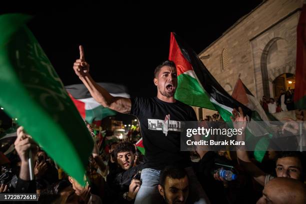 People gather in support of the recent attacks on Israel by the Palestinian militant group Hamas at Fatih Mosque on October 07, 2023 in Istanbul,...