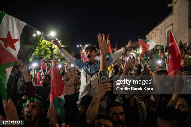 People gather in support of the recent attacks on Israel by the Palestinian militant group Hamas at Fatih Mosque on October 07, 2023 in Istanbul,...