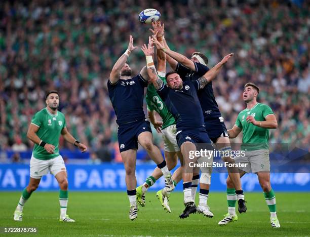 Ewan Ashman, Rory Sutherland and Scott Cummings of Scotland contends for the aerial ball with Garry Ringrose of Ireland during the Rugby World Cup...