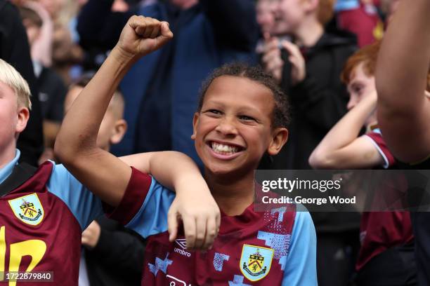 Burnley fan celebrates during the Premier League match between Burnley FC and Chelsea FC at Turf Moor on October 07, 2023 in Burnley, England.