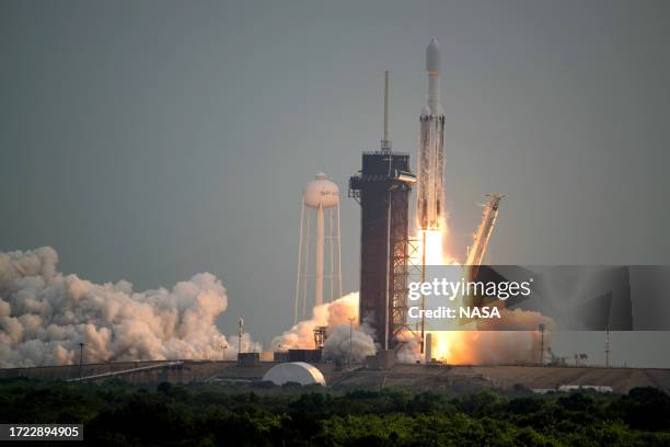 In this handout provided by NASA, a SpaceX Falcon Heavy rocket with the Psyche spacecraft onboard is launched from Launch Complex 39A, October 13,...