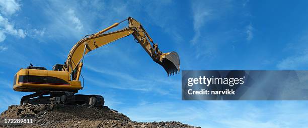 yellow excavator at work - digging machine stock pictures, royalty-free photos & images