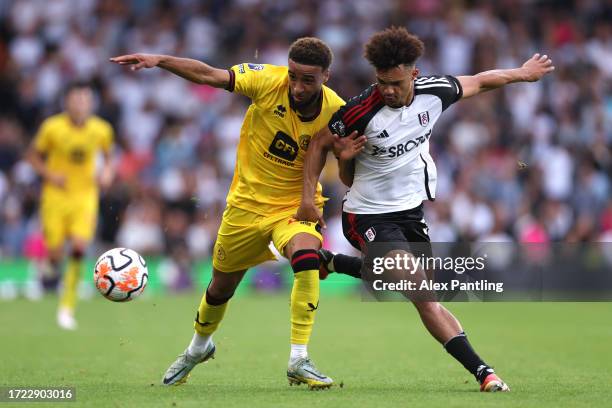 Jayden Bogle of Sheffield United is challenged by Antonee Robinson of Fulham during the Premier League match between Fulham FC and Sheffield United...