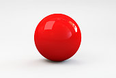 A shiny red ball with shadow on a white background