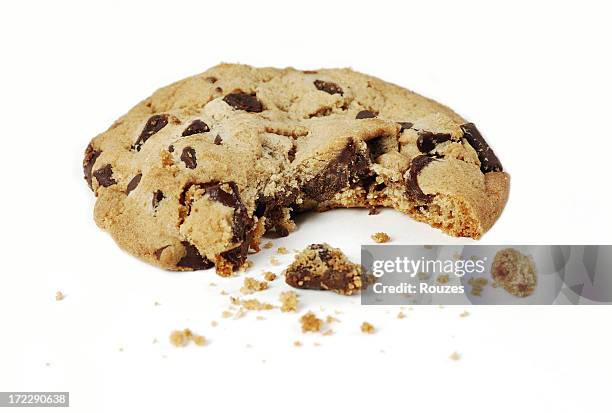 close-up of a chocolate chip cookie with a bite - smula bildbanksfoton och bilder