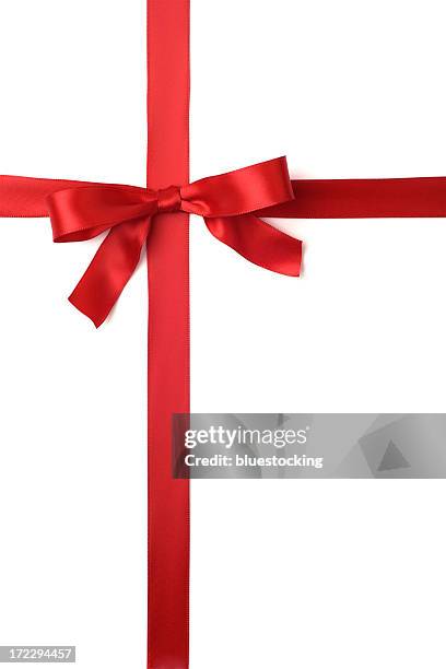 a red ribbon tied in a bow across the page - ribbon stockfoto's en -beelden