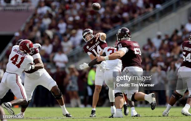 Max Johnson of the Texas A&M Aggies throws a pass in the first half against the Alabama Crimson Tide at Kyle Field on October 07, 2023 in College...
