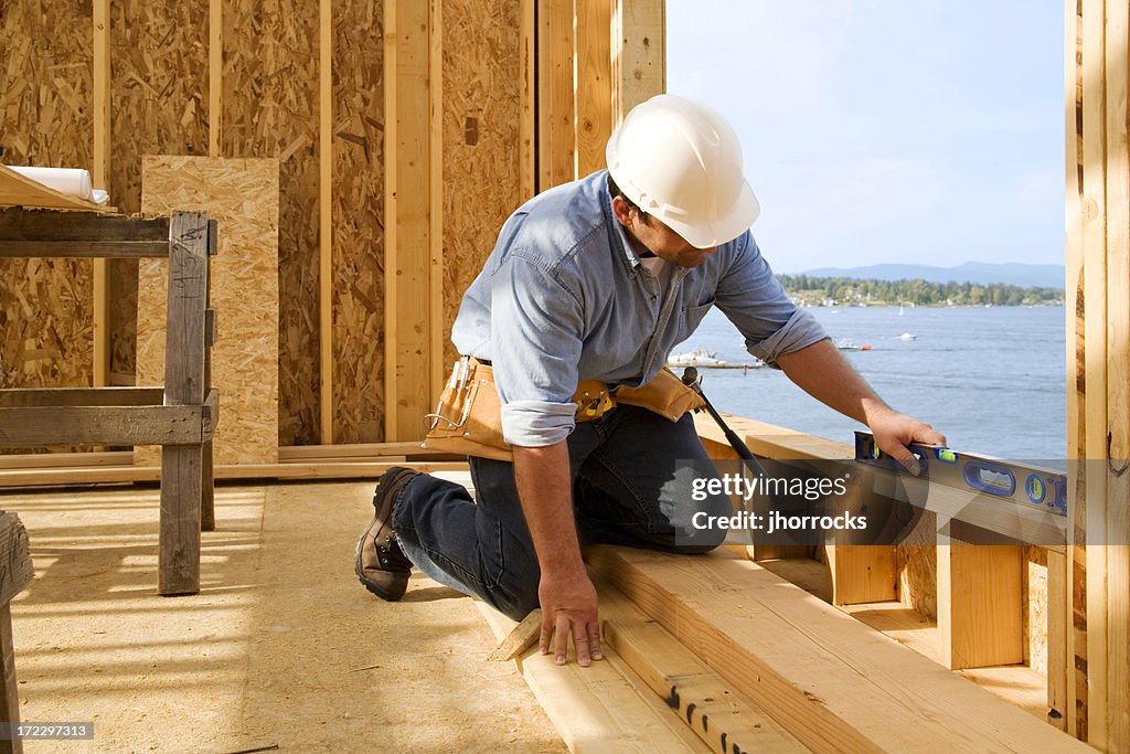 Checking Level Construction Worker Checking Level High-Res Stock Photo - Getty Images