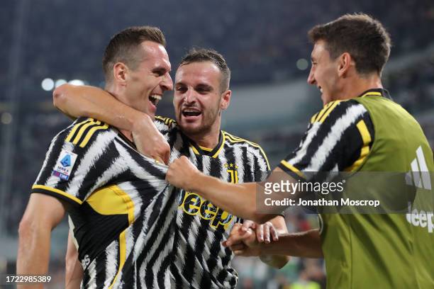 Arkadiusz Milik of Juventus celebrates with team mates Federico Gatti and Andrea Cambiaso after scoring to give the side a 2-0 lead during the Serie...