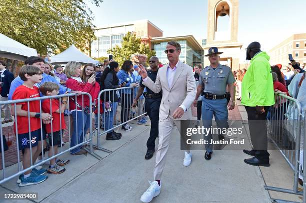 Head coach Lane Kiffin of the Mississippi Rebels greets fans before the game against the Arkansas Razorbacks at Vaught-Hemingway Stadium on October...