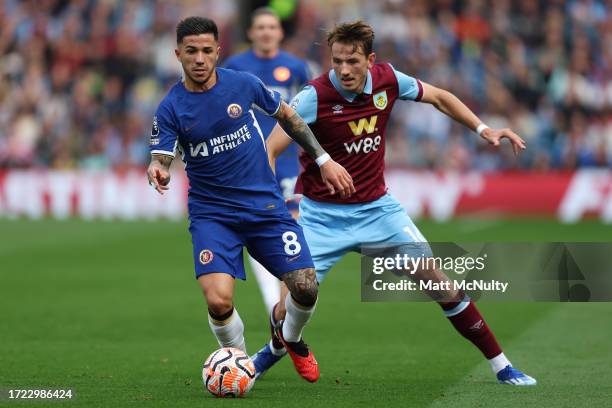 Enzo Fernandez of Chelsea battles for possession with Sander Berge of Burnley during the Premier League match between Burnley FC and Chelsea FC at...