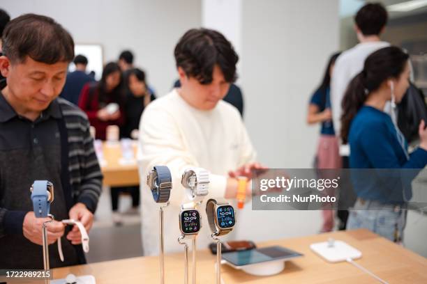 Customers experience the newly launched Apple Watch Ultra 2 and Apple Watch 9 at Apple store in Yeouido on October 13, 2023 in Seoul, South Korea....