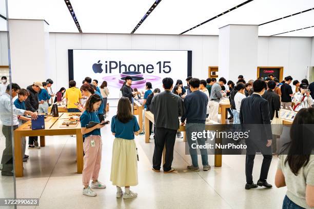 Customers experience the newly launched iPhone 15 series , Apple Watch Ultra 2 and Apple Watch 9 at Apple store in Yeouido on October 13, 2023 in...