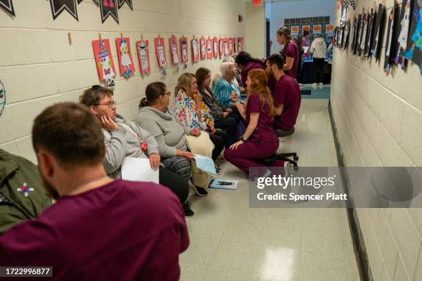 Optometry students administer vision tests to patients for a free pair of eyeglasses at a Remote Area Medical mobile dental and medical clinic on...