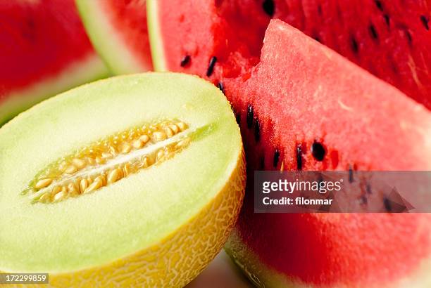 close up of sliced melon and watermelon - meloen stockfoto's en -beelden