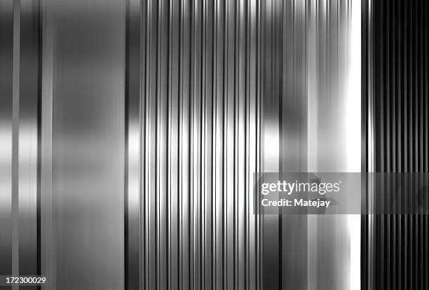 abstract background of vertical stainless steel panels - metal texture stockfoto's en -beelden