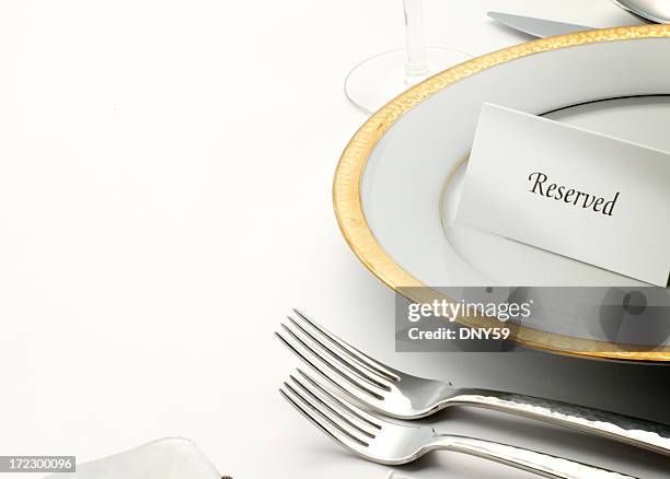 reserved table tent on top of table setting - gold plate stock pictures, royalty-free photos & images