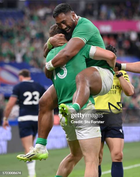 Garry Ringrose of Ireland celebrates scoring his team's sixth try with teammate Bundee Aki during the Rugby World Cup France 2023 match between...