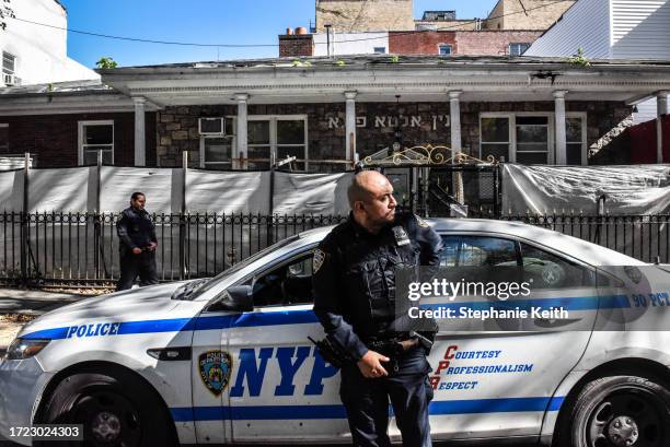 Members of the New York Police Department patrol in front of a synagogue on October 13, 2023 in the Williamsburg neighborhood in the borough of...