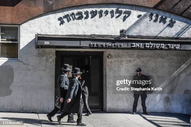 Member of the New York Police Department patrols in front of a synagogue on October 13, 2023 in the Williamsburg neighborhood in the borough of...