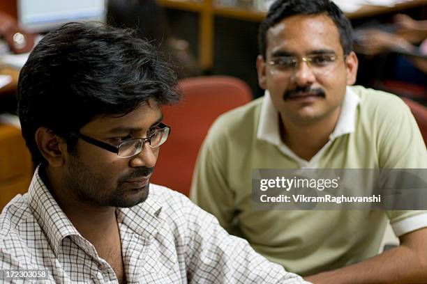 indian it team two software engineer office worker people horizontal - bangladesh worker stock pictures, royalty-free photos & images