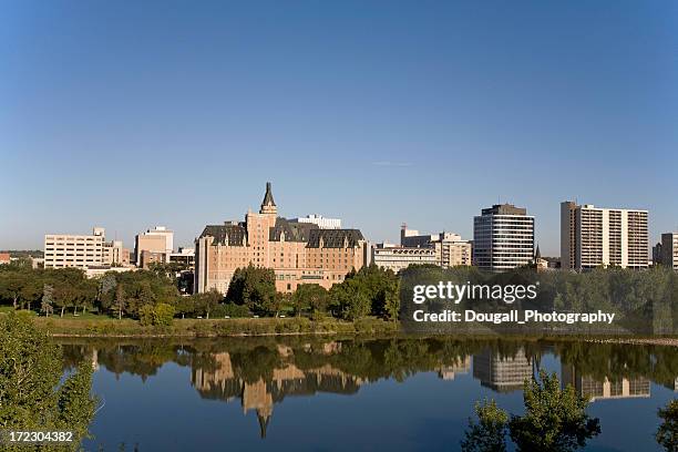 saskatoon riverbank with bessborough hotel - saskatoon stockfoto's en -beelden