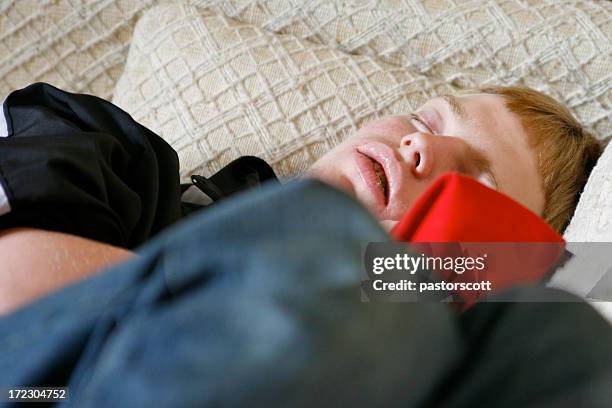 asleep - man sleeping with cap stock pictures, royalty-free photos & images