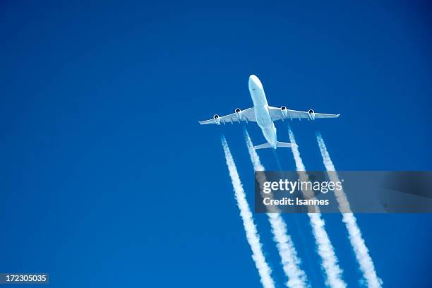 flying high. commercial jet at altitude - greenhouse gas stock pictures, royalty-free photos & images