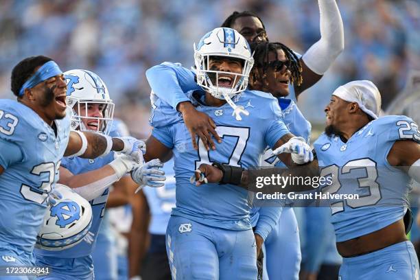 Amare Campbell of the North Carolina Tar Heels celebrates with teammates after making an inteception against the Syracuse Orange during the second...