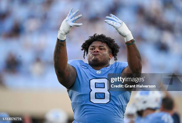 Myles Murphy of the North Carolina Tar Heels signals the start of the fourth quarter during their game against the Syracuse Orange at Kenan Memorial...