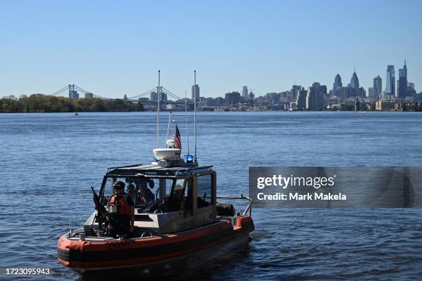Coast Guard boat patrols the Delaware River beside the Tioga Marine Terminal before President Joe Biden speaks on October 13, 2023 in Philadelphia,...