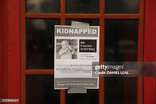 Poster showing a recently kidnapped or missing Israeli baby, after the Hamas attack in Israel is seen attached to a telephone box in Stamford Hill,...