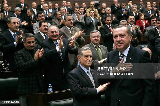 Deputies applaud after Turkish Prime Minister Recep Tayyip Erdogan addressed the parliament in Ankara on January 31, 2012. Turkey on Tuesday welcomed...