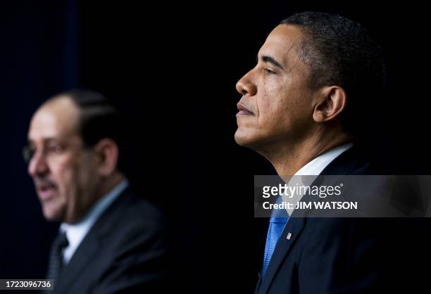 President Barack Obama speaks with Iraqi Prime Minister Nouri al-Maliki during a joint press conference in the Eisenhower Executive Office Building...