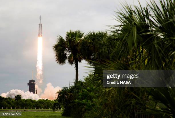 In this handout provided by NASA, a SpaceX Falcon Heavy rocket with the Psyche spacecraft onboard is launched from Launch Complex 39A, October 13,...