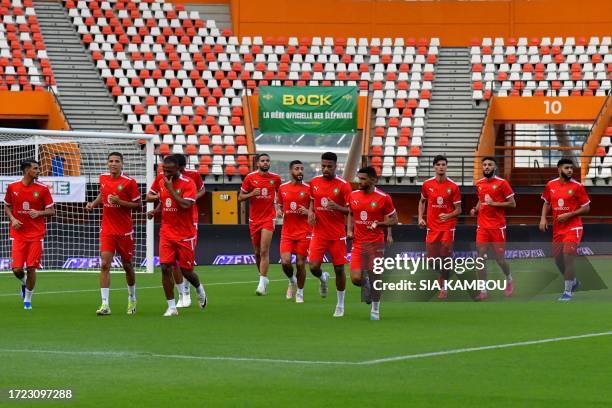 Morocco's players warm up during a training session at the Felix Houphouet Boigny Stadium on the eve of their international friendly football match...