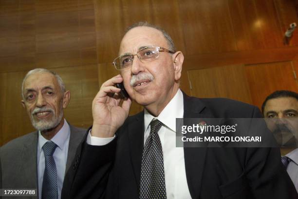 Newly-elected Libyan Prime Minister Abdel Rahim al-Keib speaks on the phone at the end of a public vote in Tripoli on October 31, 2011. Libya's...