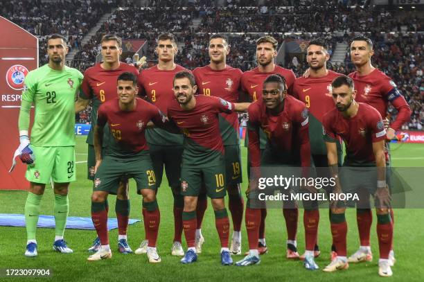 Portugal's players pose for a team photo before the start of the EURO 2024 first round group A qualifying football match between Portugal and...