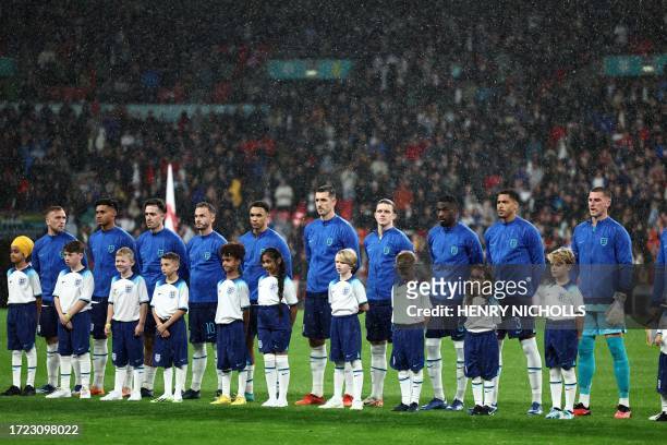 England players and mascots line up ahead of the international friendly football match between England and Australia at Wembley stadium in north...