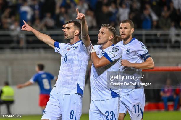 Amar Rahmanovic of Bosnia and Herzegovina celebrates after scoring his team's first goal with teammates during the UEFA EURO 2024 European qualifier...