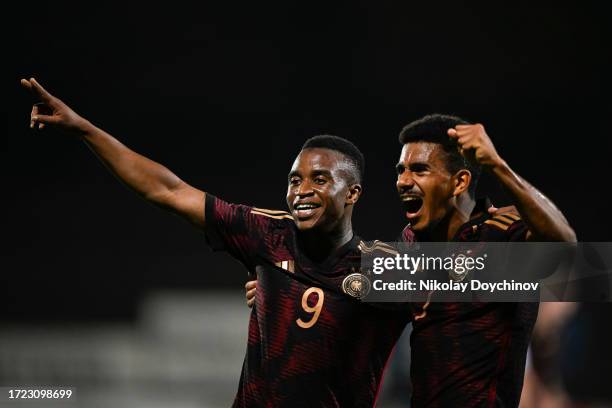 Youssoufa Moukoko of Germany celebrates with teammate Ansgar Knauff after scoring his third goal during the UEFA Under21 EURO 2025 Qualifier match...