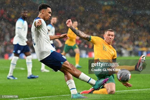 England's defender Trent Alexander-Arnold vies with Australia's striker Mitchell Duke during the international friendly football match between...