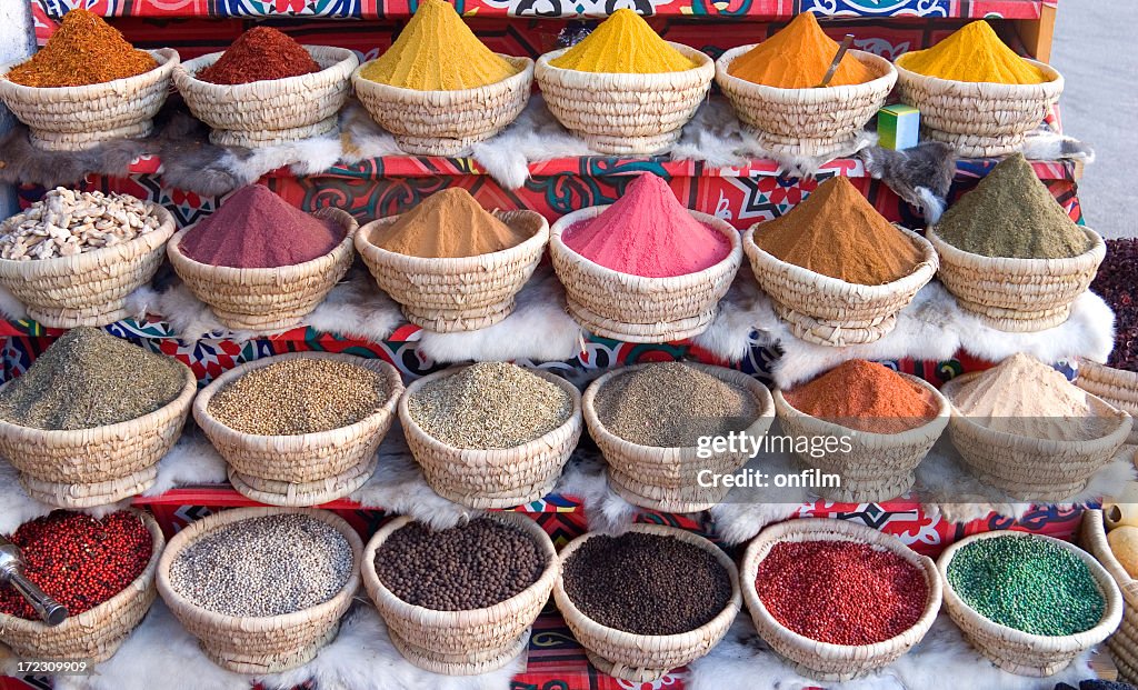 An Egyptian spice market with baskets full of spice